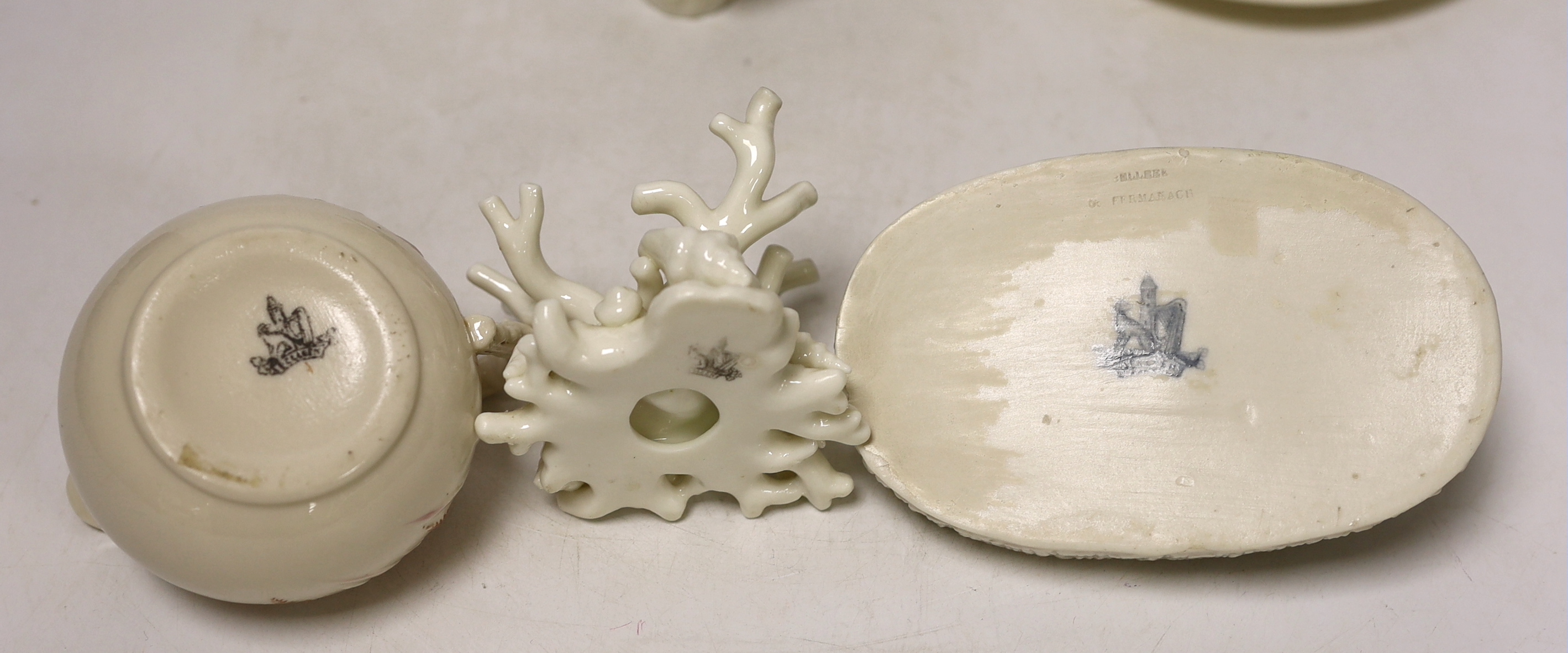 A small quantity of 1st and 2nd period Belleek including a ‘frog’ paperweight and a ‘beehive’ honey jar together with a related reference book by Marion Langham
